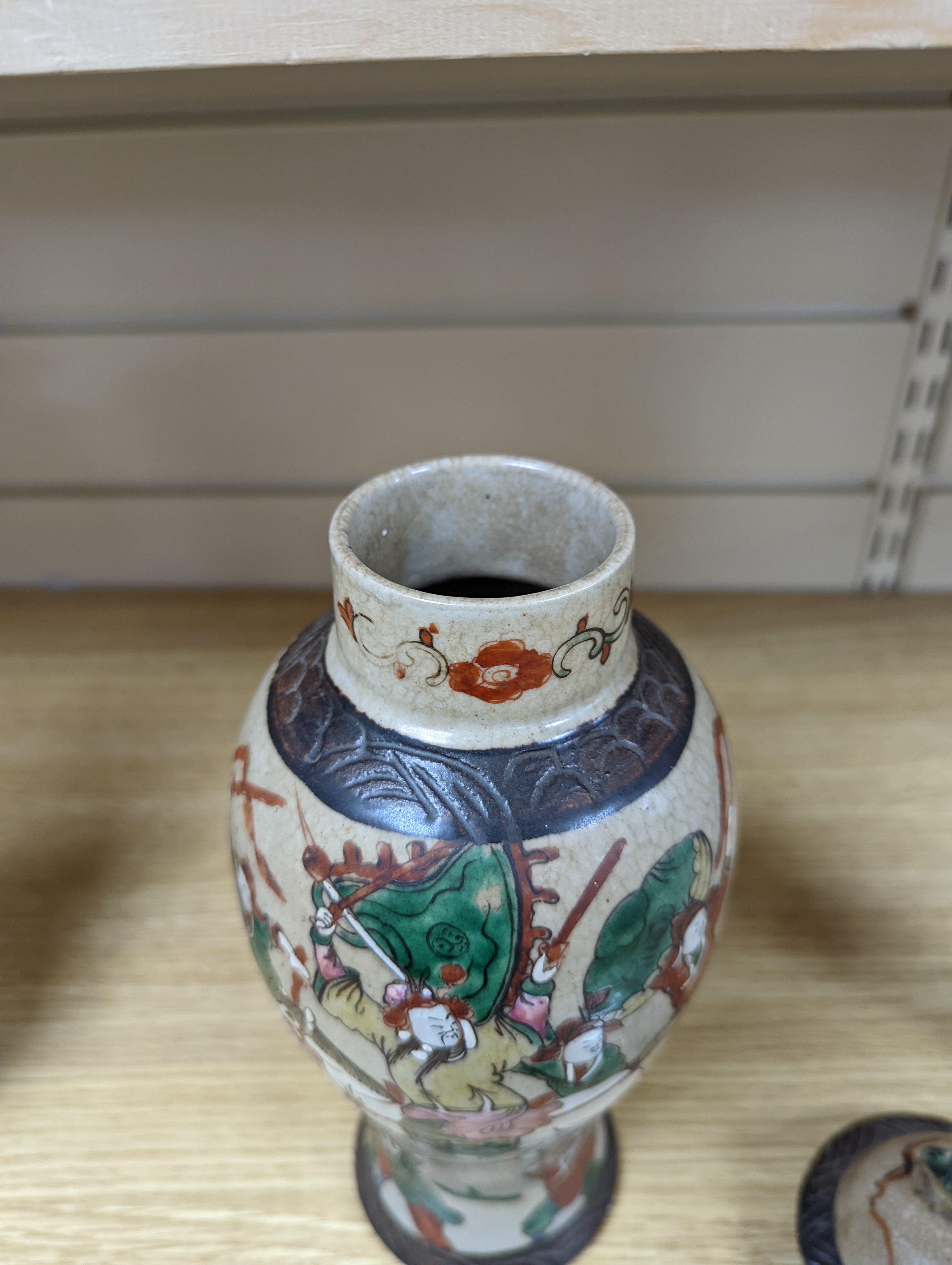 A late 19th century Chinese crackle glaze famille rose baluster vase and cover 30cm